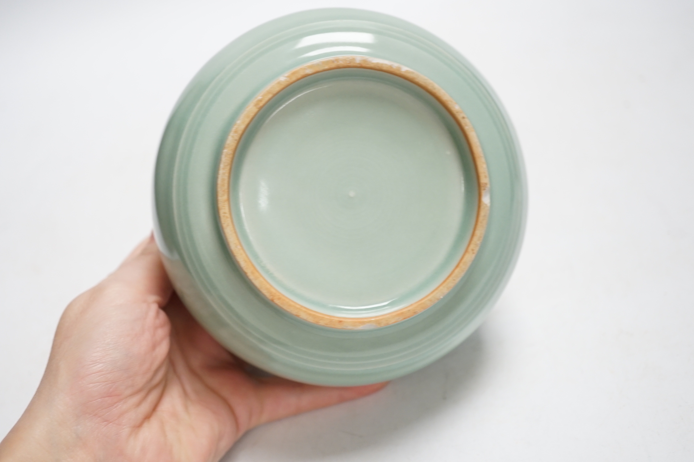 A Chinese celadon glazed pot, 8cm high
